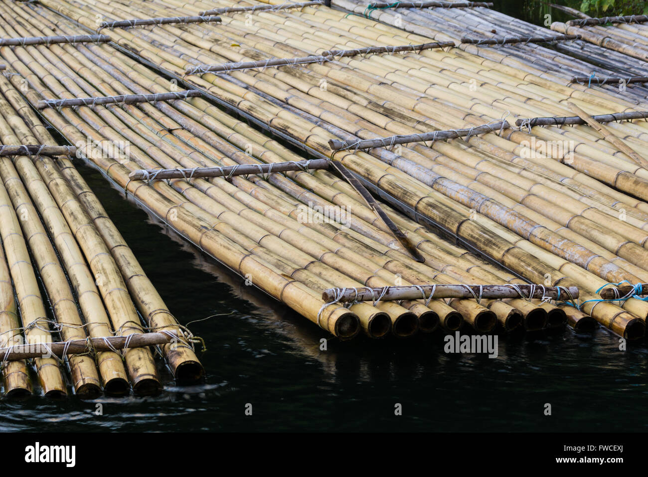 Traditional bamboo rafts were how locals traveled and carried goods for trade. Stock Photo