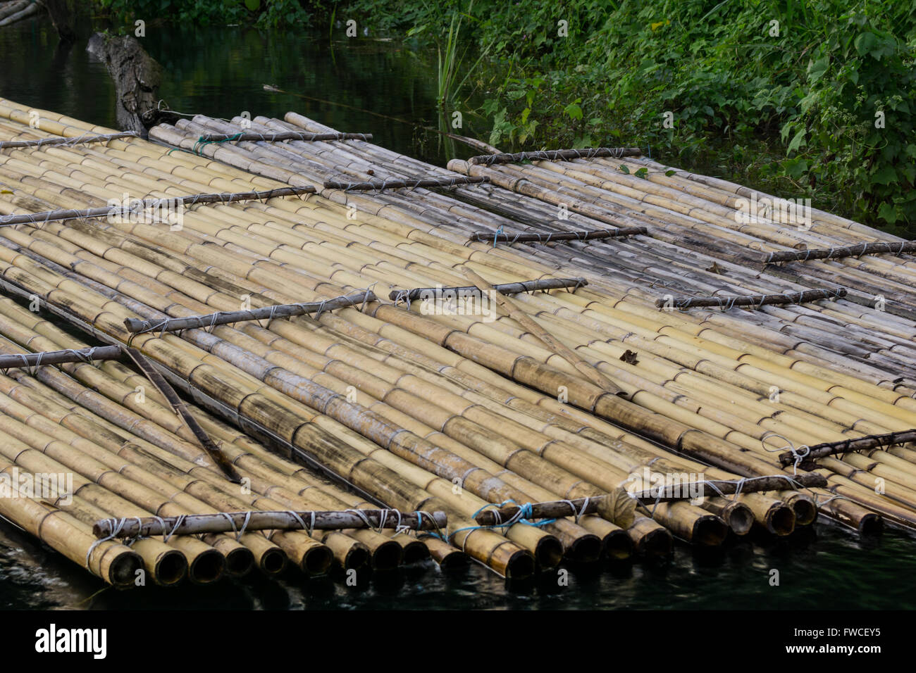 Traditional bamboo rafts were how locals traveled and carried goods for trade. Stock Photo