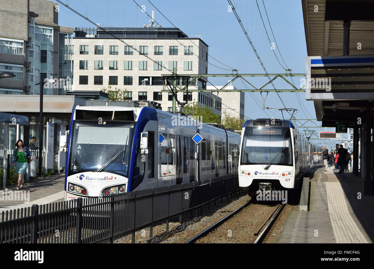 Two types of the Randstadrail rolling stock at Laan van NOI station platforms Stock Photo