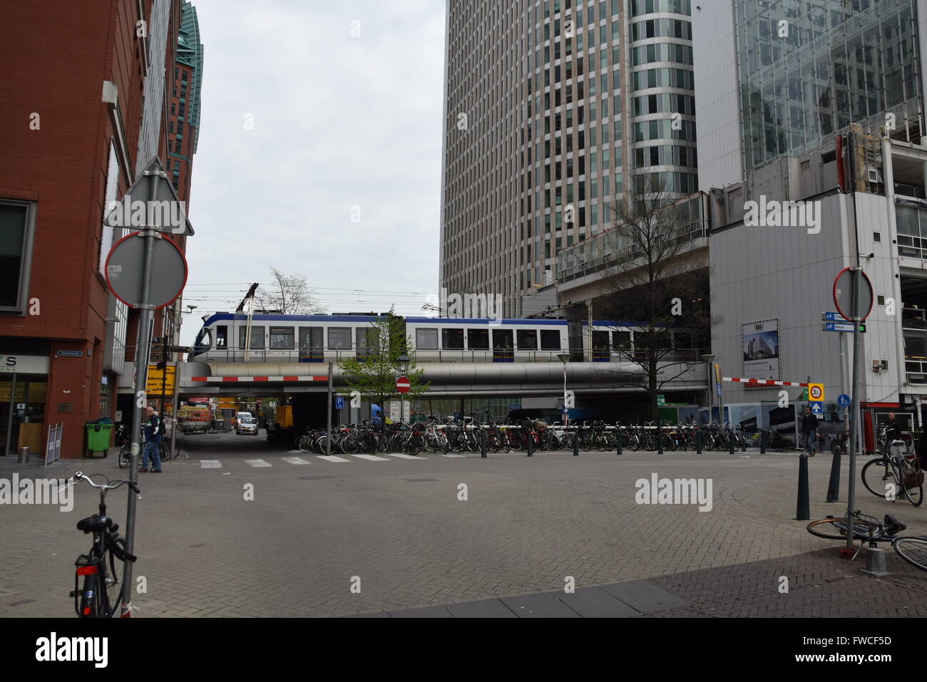 Randstadrail tram on an elevated bridge over a kanal near Den Haag Centraal Station Stock Photo