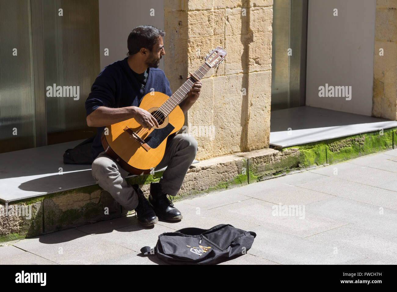 Spanish guitar player busking in the street Stock Photo - Alamy