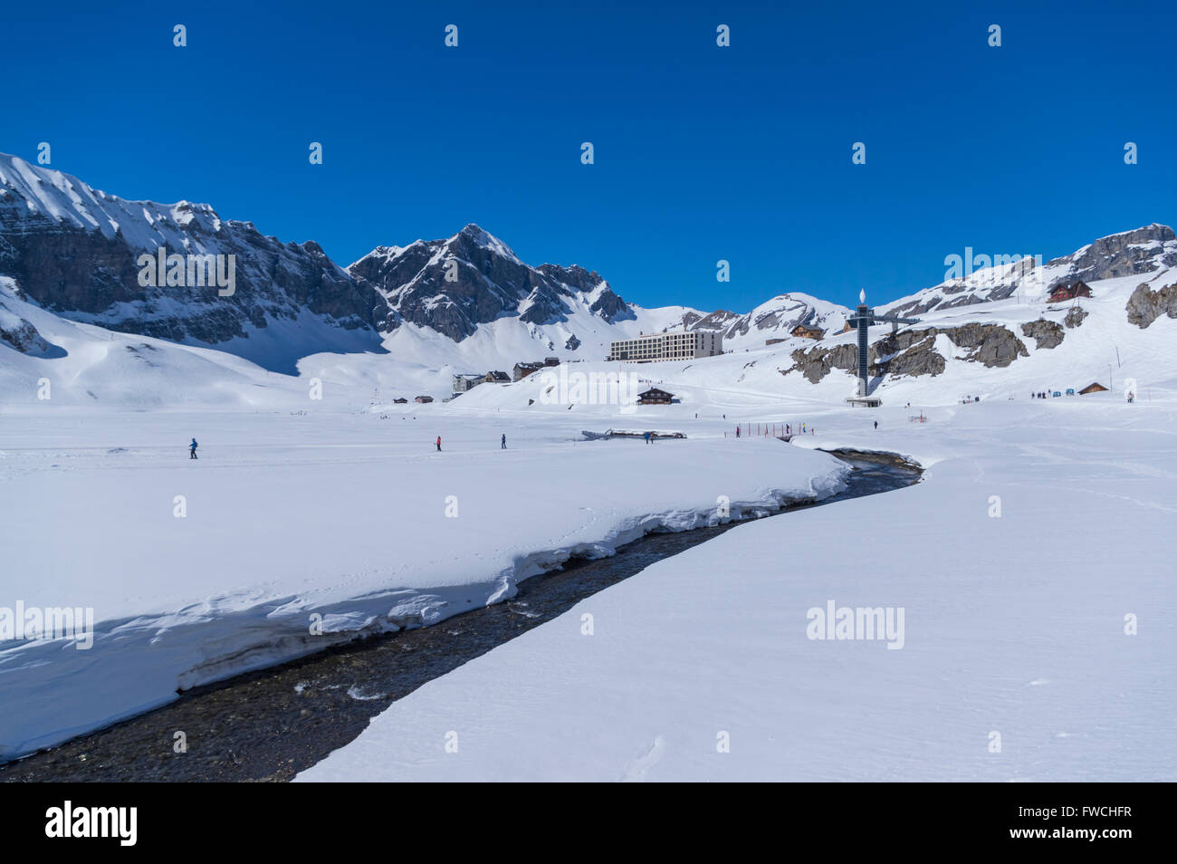 Melchsee-Frutt, a village and winter sports resort in Switzerland, surrounded by mountains, seen from a distance. Stock Photo