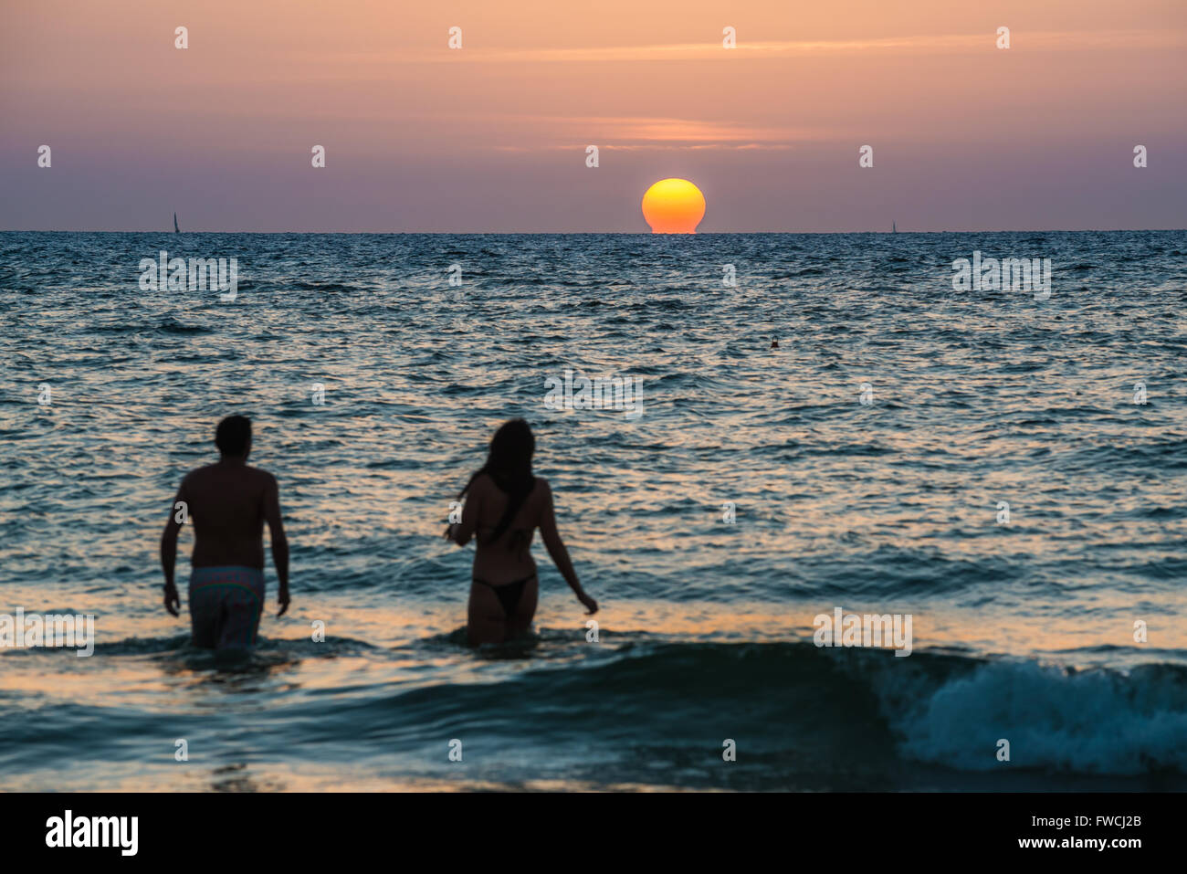 Sunset over Mediterranean Sea seen from the beach in Tel Aviv city ...