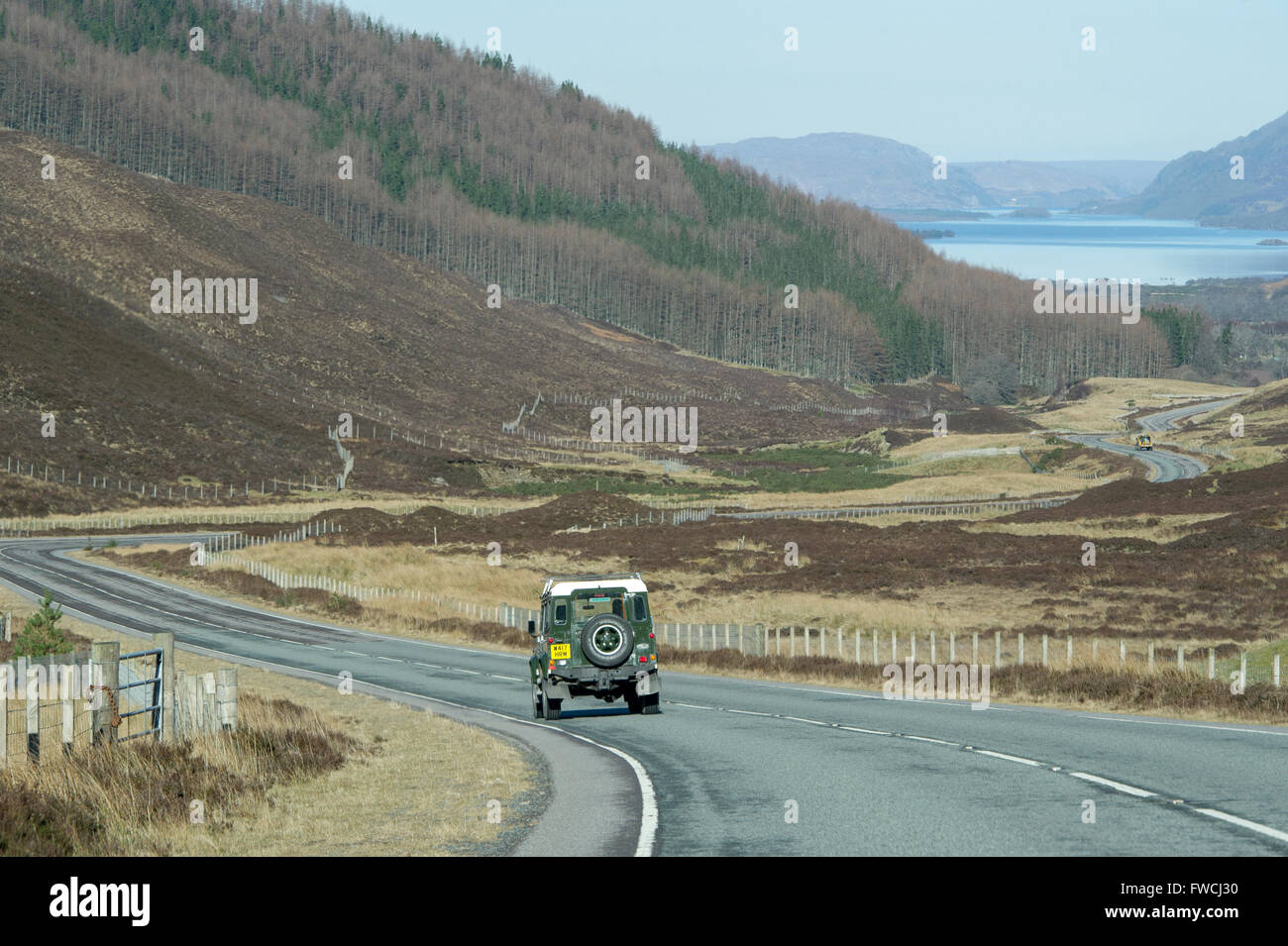 Land Rover 4x4 car alone on a remote Scottish Highland road, part of the North Coast 500 route Stock Photo