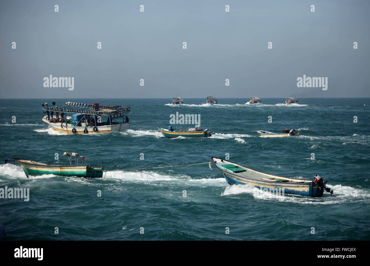 Gaza City, Gaza Strip, Palestinian Territory. 3rd Apr, 2016. Palestinian fishermen ride their fishing boat at the beach of Gaza City on April 03, 2016. Israel on Sunday extended the distance it permits Gaza fishermen to head out to sea along certain parts of the coastline of the enclave, which is run by the Islamist group Hamas. The fishing zone was expanded from six nautical miles (11 km) to nine (16 km) along Gaza's central and southern shores, a step that Israeli authorities said should result in a bigger catch in deeper waters, where fish are more abundant (Credit Image: © Ashraf Amra/A Stock Photo