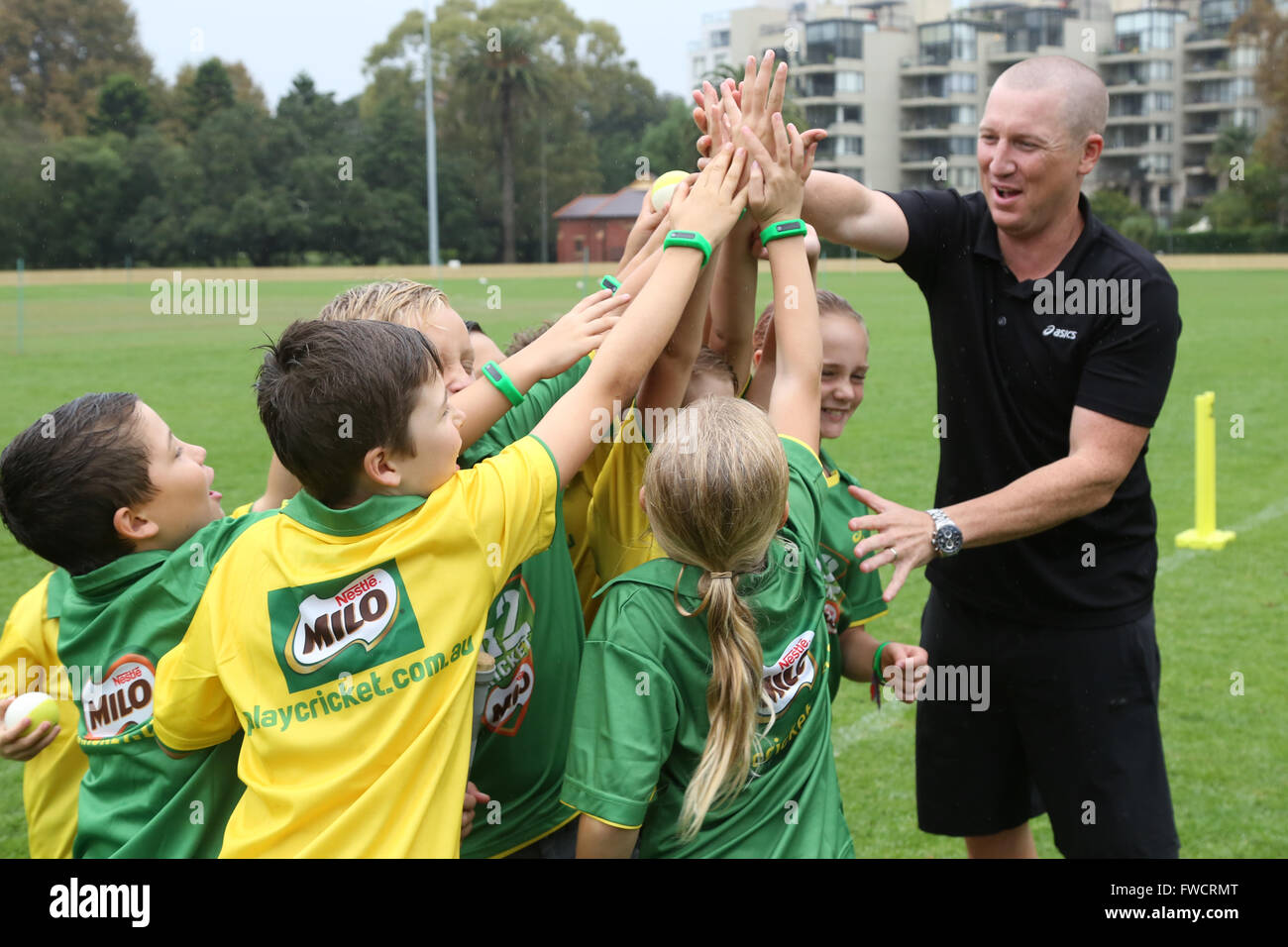 Sydney, Australia. 4 April 2016. New research reveals that Australian parents are increasingly worried about their couch potato kids; the majority of Australian children are getting less than half the recommended daily amount of exercise. In an effort to encourage kids to get active and eat a healthy diet, Brad Haddin completed drills and with junior cricketers from Cricket Australia.  As a Dad of three, Brad also tested a new kids fitness tracker by Milo that helps parents monitor their kids activity levels and dietary intake through an interactive app. Credit: Richard Milnes/Alamy Live News Stock Photo