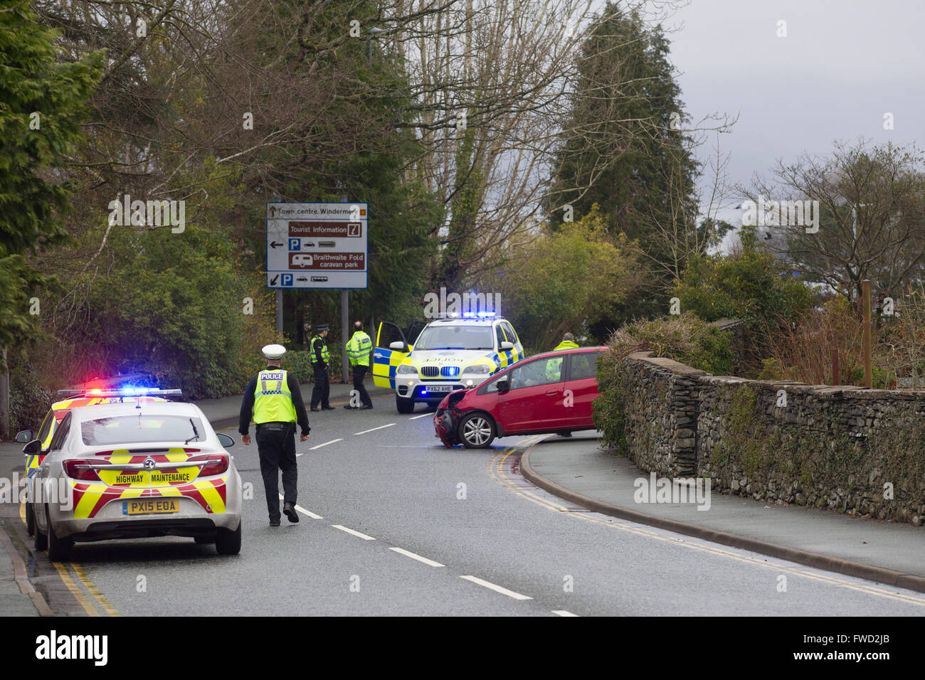 Bowness on Windermere, Cumbria, UK. 4th April, 2016. Emergency services dealing with  serious road traffic collision on the A592 in Windermere, with a section of the road closed as a result. Police were called to the incident at 3pm today (April 4) at the junction of Glebe Road, Windermere, following a report of a one vehicle road traffic collision. Motorists are asked to avoid the area and use alternative routes Credit:  Gordon Shoosmith/Alamy Live News Stock Photo