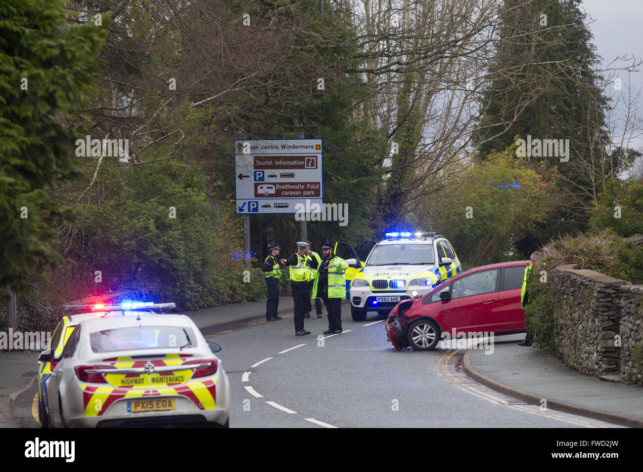 Bowness on Windermere, Cumbria, UK. 4th April, 2016. Emergency services dealing with  serious road traffic collision on the A592 in Windermere, with a section of the road closed as a result. Police were called to the incident at 3pm today (April 4) at the junction of Glebe Road, Windermere, following a report of a one vehicle road traffic collision. Motorists are asked to avoid the area and use alternative routes Credit:  Gordon Shoosmith/Alamy Live News Stock Photo