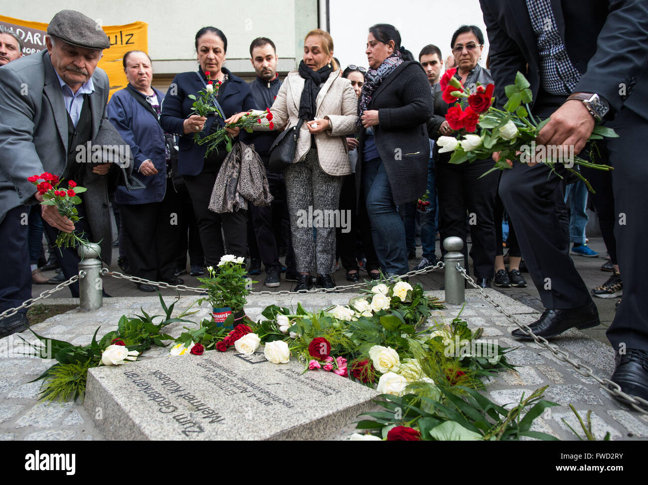 Dortmund, Germany. 4th Apr, 2016. The widow Elif Kubasik (3rd l) as well as family members and representatives of the city of Dortmund commemorate the cinema owner Mehmet Kubasik, murdered by the NSU terror group, in Dortmund, Germany, 4 April 2016. 10 years ago, Kubasik became the eighth victim of the Neonazi terror group. PHOTO: BERND THISSEN/dpa/Alamy Live News Stock Photo