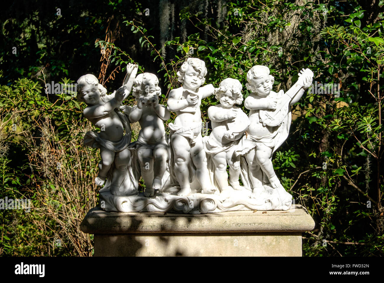 Statue of angles playing music in secret gardens at Middleton Place, Charleston, South Carolina, USA Stock Photo