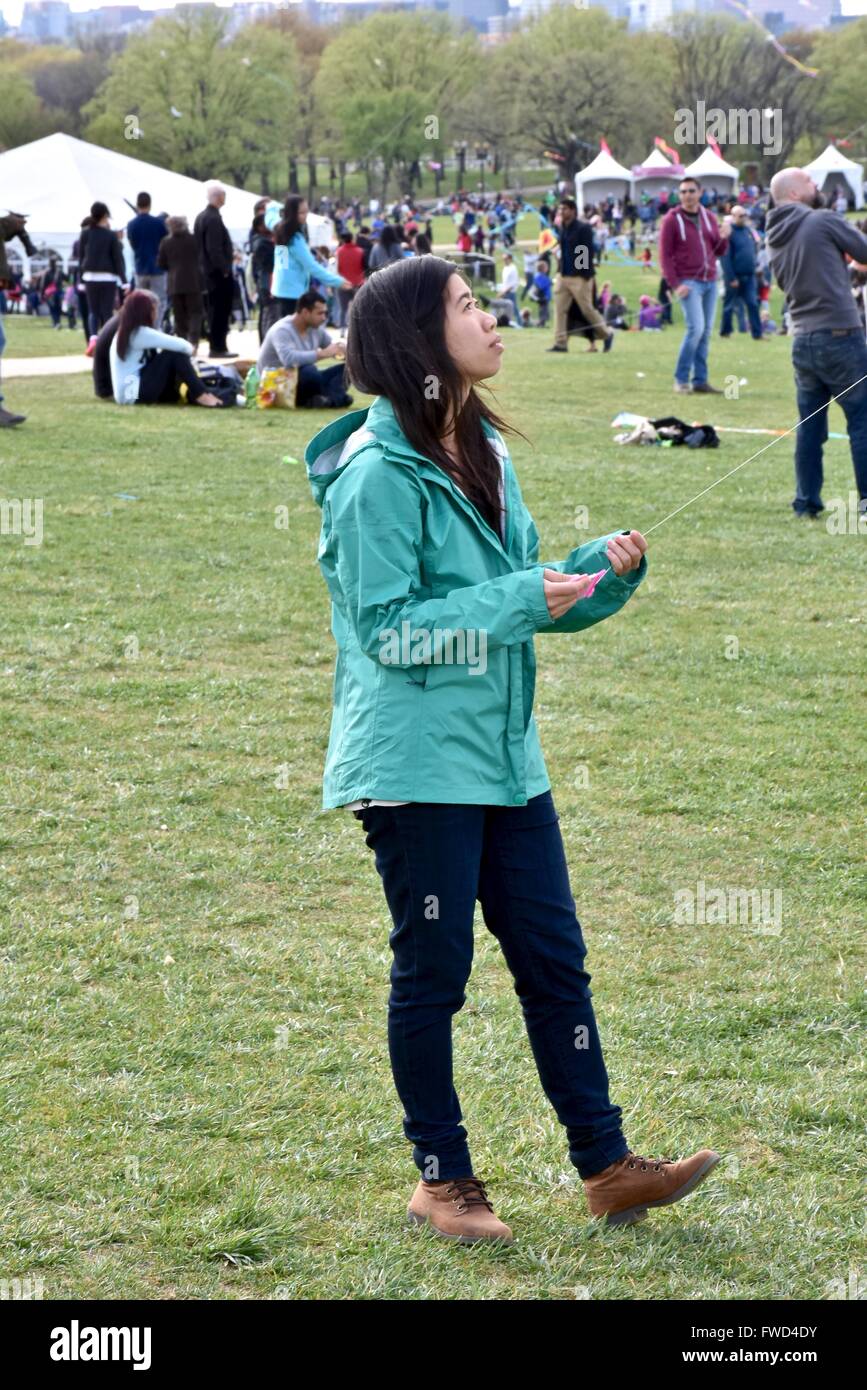 Tourist flying a kite during the Cherry blossom festival in Washington