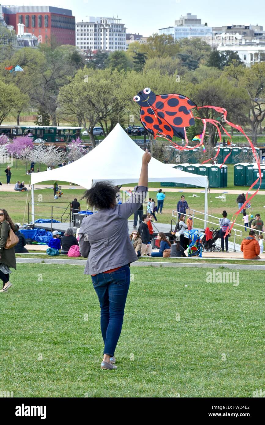 Tourist flying a kite during the Cherry blossom festival in Washington