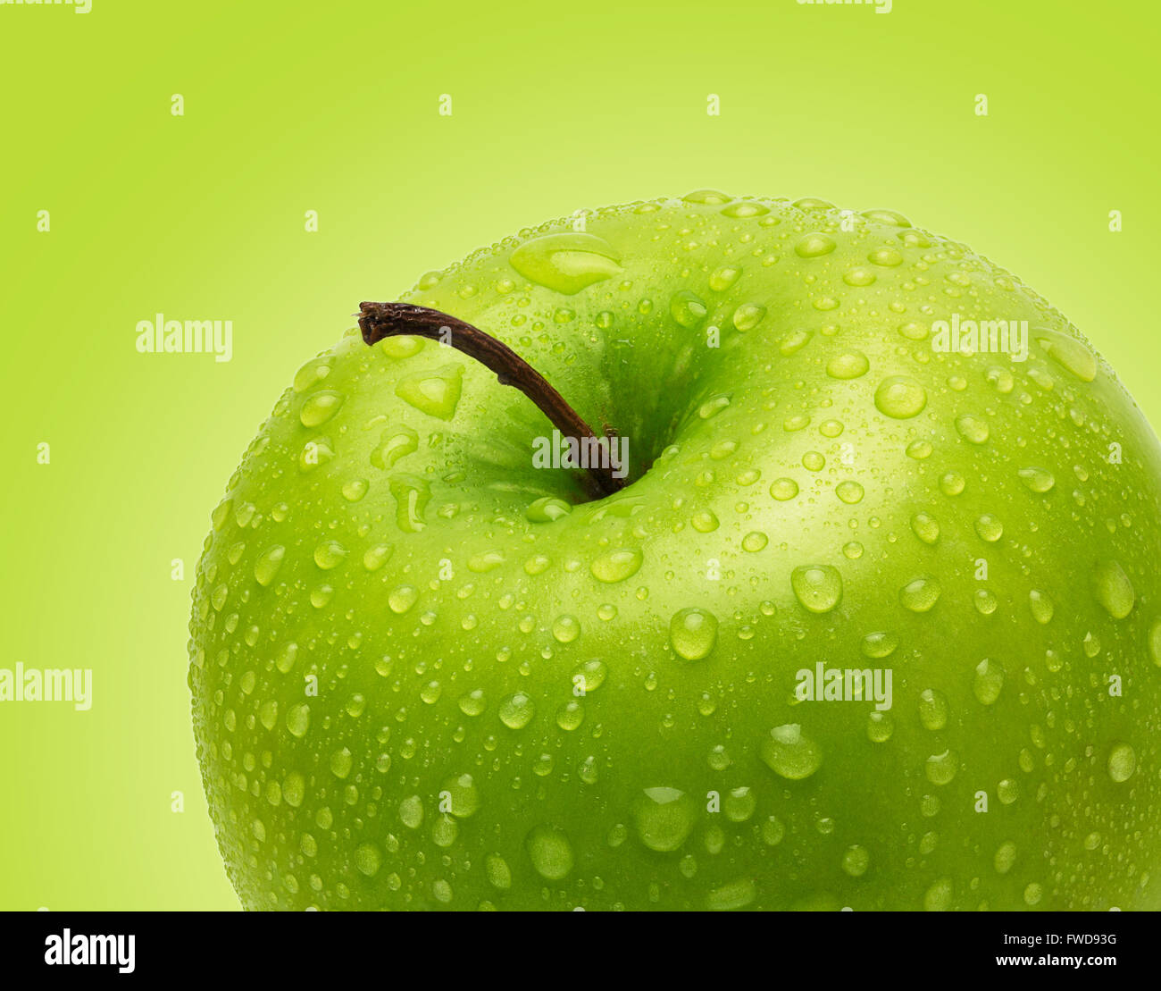 Perfect Fresh Green Apple Isolated on Green Background in Full Depth of Field with Clipping Path. Stock Photo
