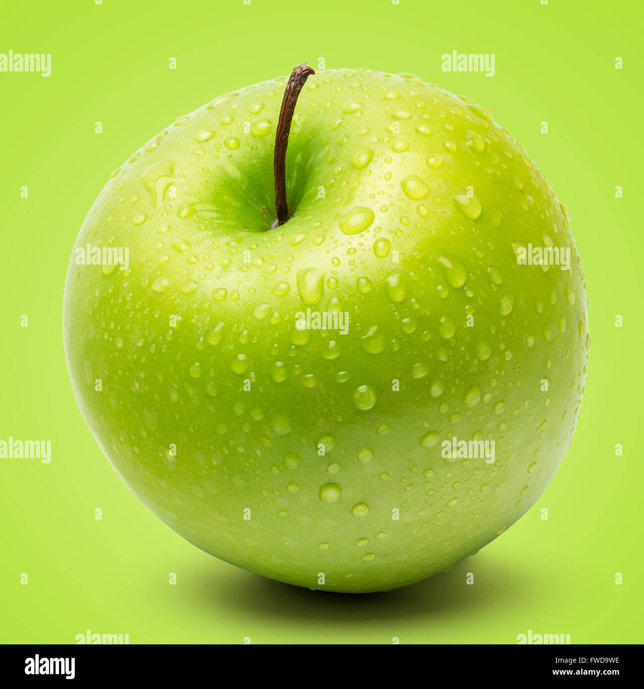 Perfect Fresh Green Apple Isolated on Green Background in Full Depth of Field. Stock Photo