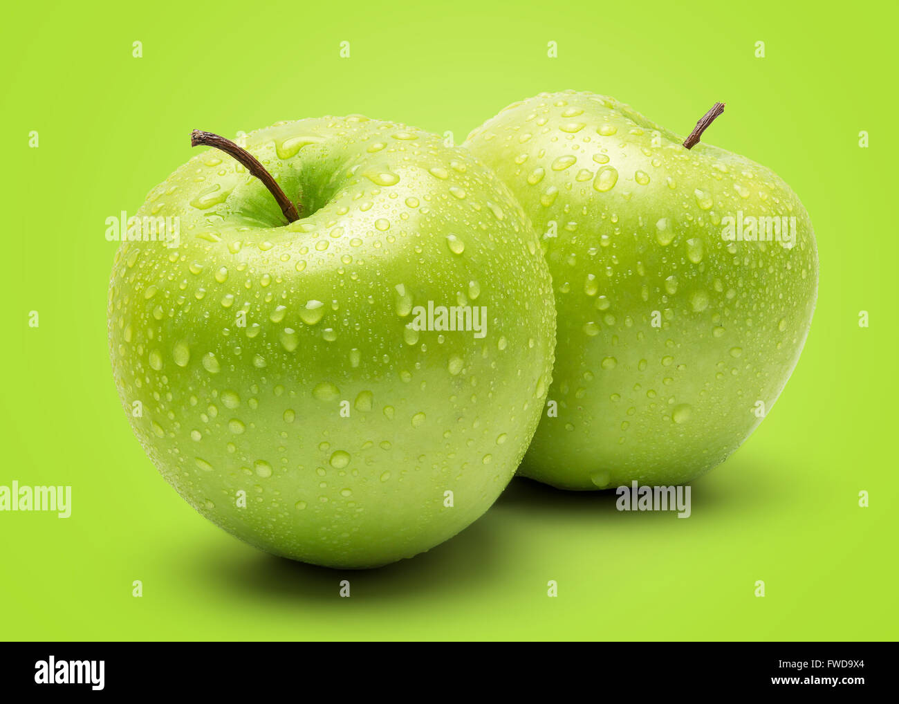 Perfect Fresh Green Apple Isolated on Green Background in Full Depth of Field. Stock Photo