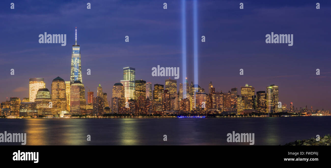 911 Memorial light and New York City skyline at night Stock Photo