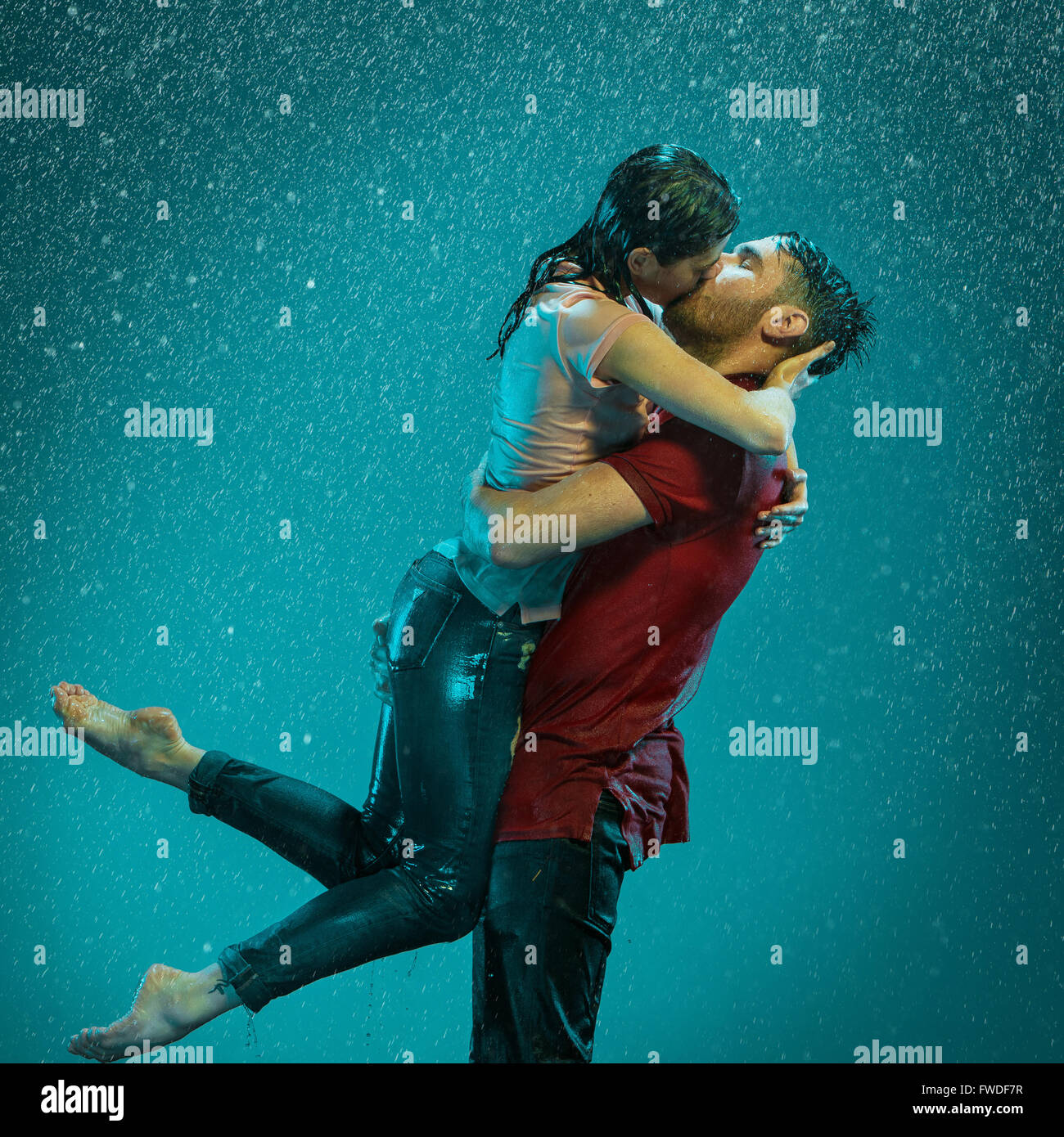 The loving couple in the rain Stock Photo - Alamy