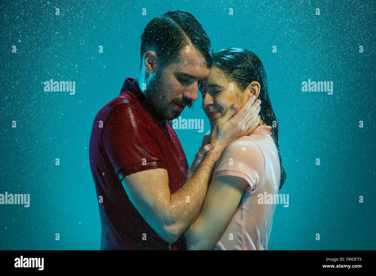 The loving couple in the rain Stock Photo - Alamy