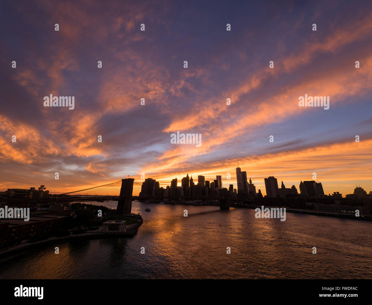 Sunset with Brooklyn Bridge and the New York City skyline Stock Photo ...