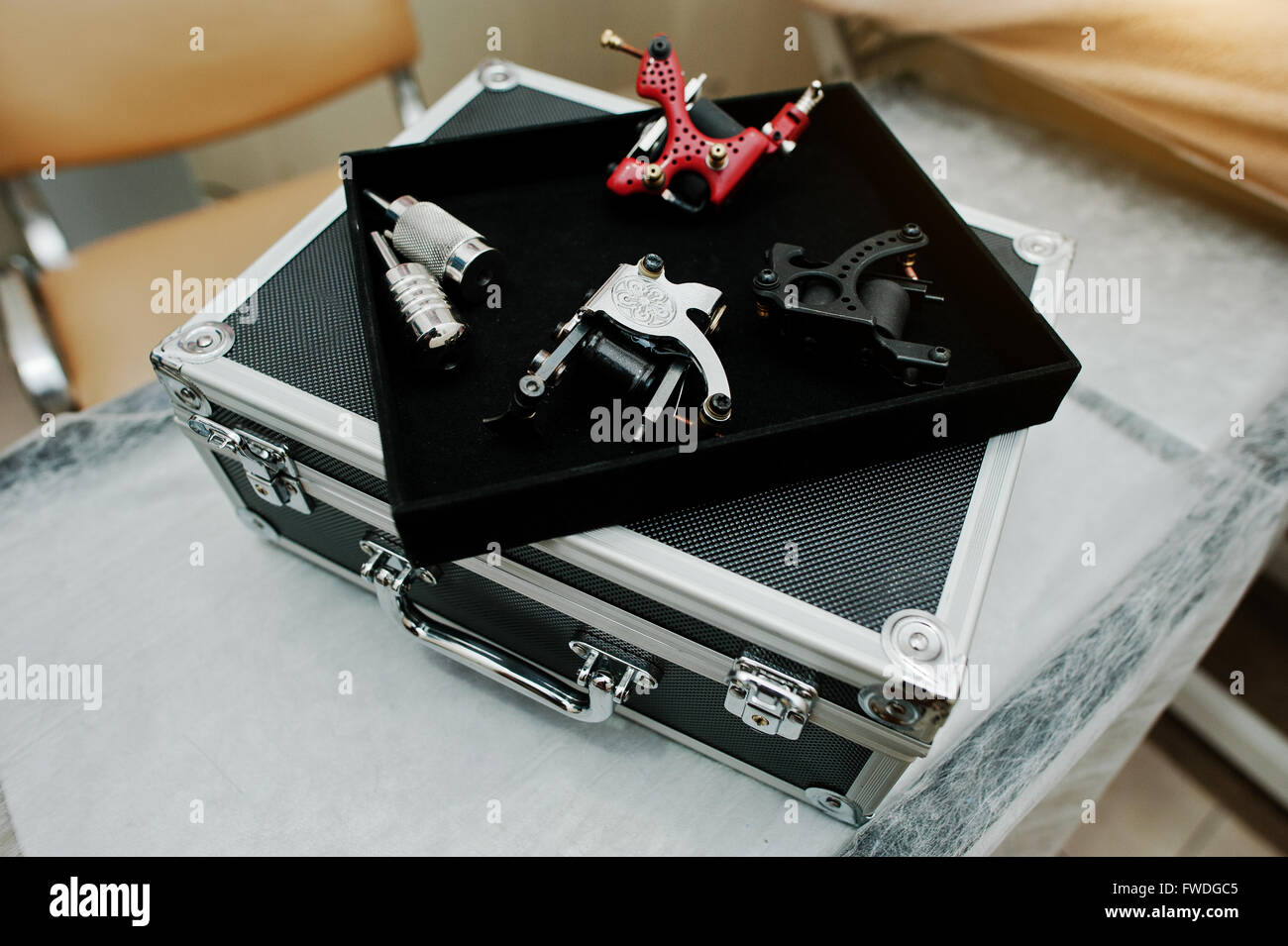 Set of tattoo machines and devices at black box Stock Photo Alamy