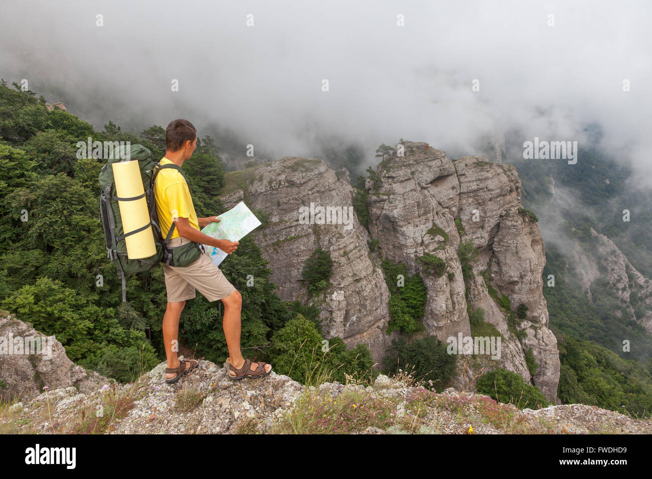 Hiker using map and compass hi-res stock photography and images - Alamy