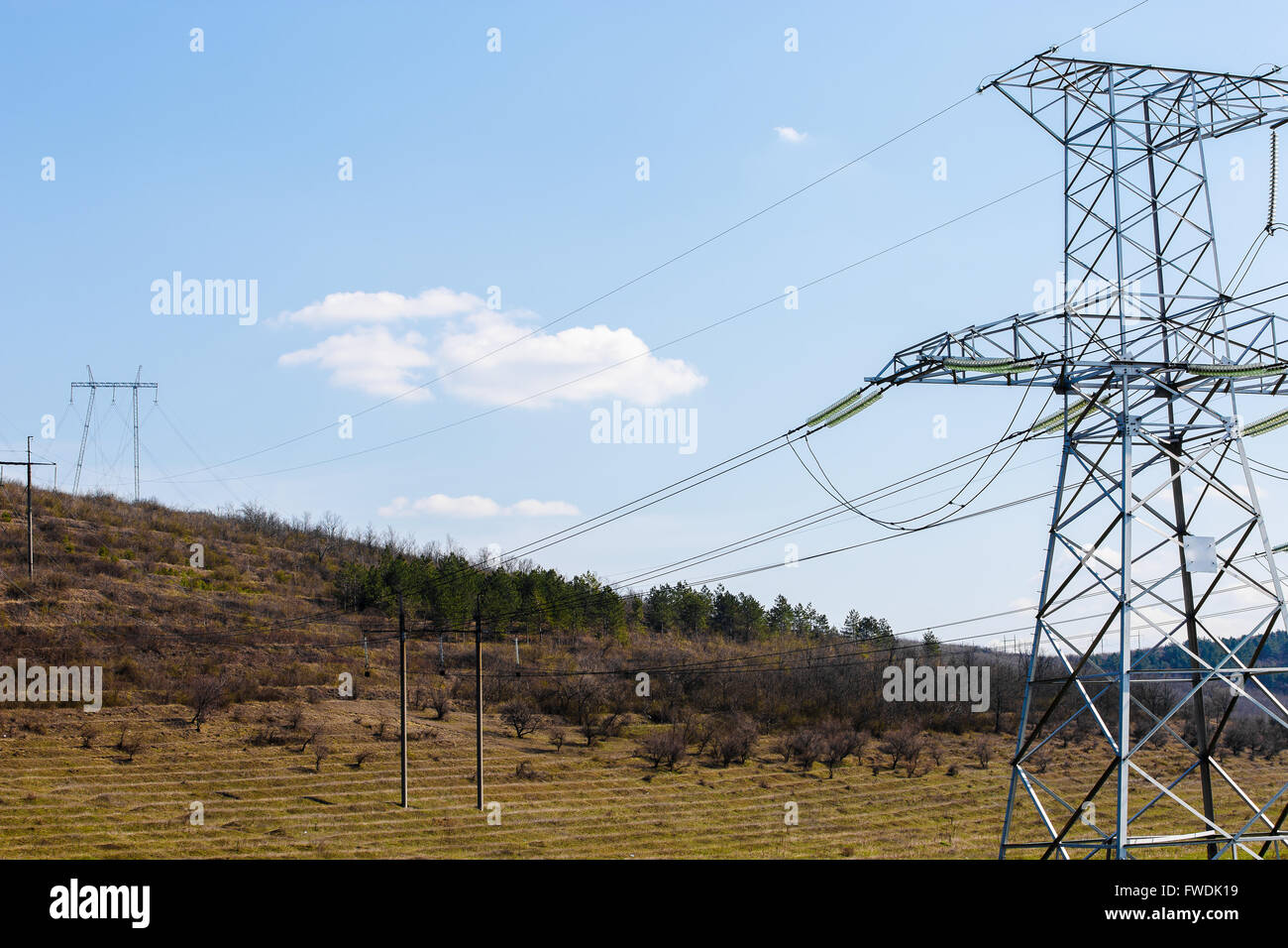 high voltage electric power lines on pylons, power transmission tower ...