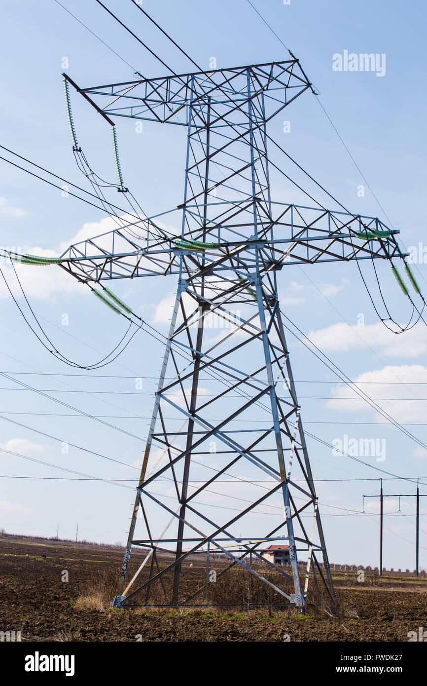 high voltage electric power lines on pylons, power transmission tower ...