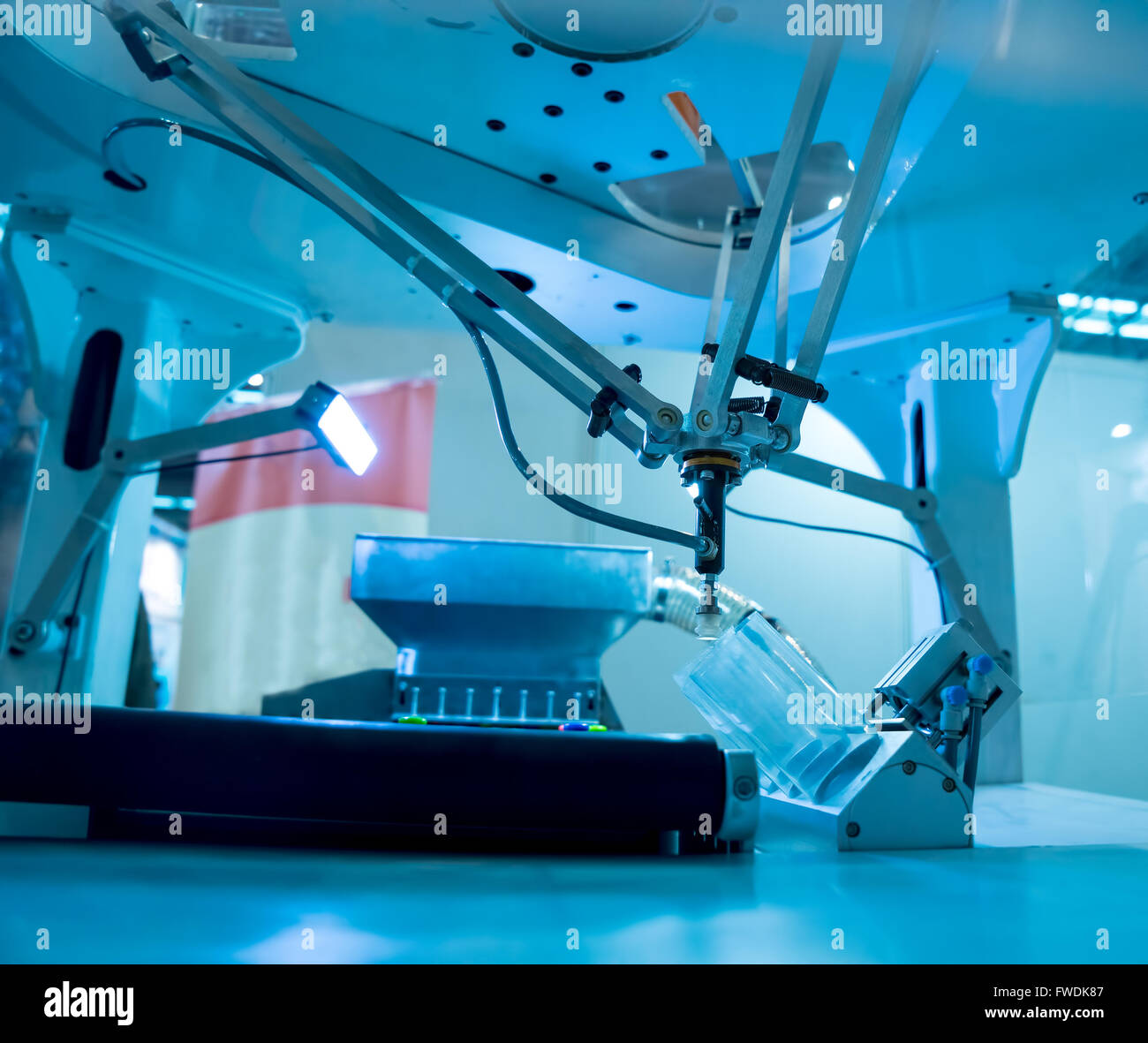 Industrial robot working in factory,Conveyor Tracking Controler of robotic hand. Stock Photo