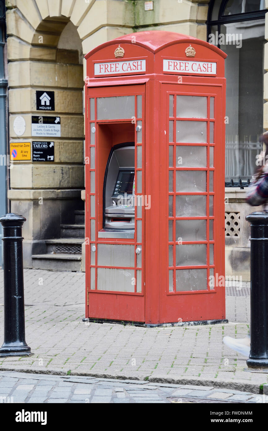 Cash machine contained in an old red telephone box Chester, England, United Kingdom. Stock Photo