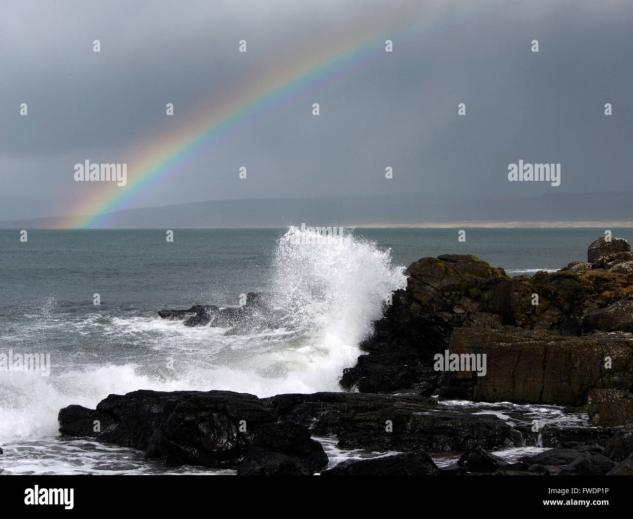 Rainbow and waves, Machrihanish, Kintyre, Scotland Stock Photo