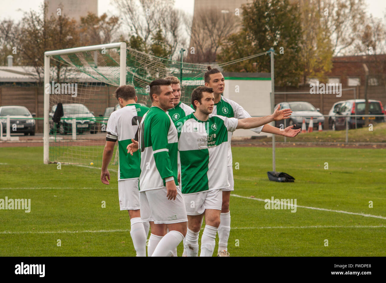 Billingham Synthonia footballers disputing the award of a penalty by the referee at an amateur football match in England. Stock Photo