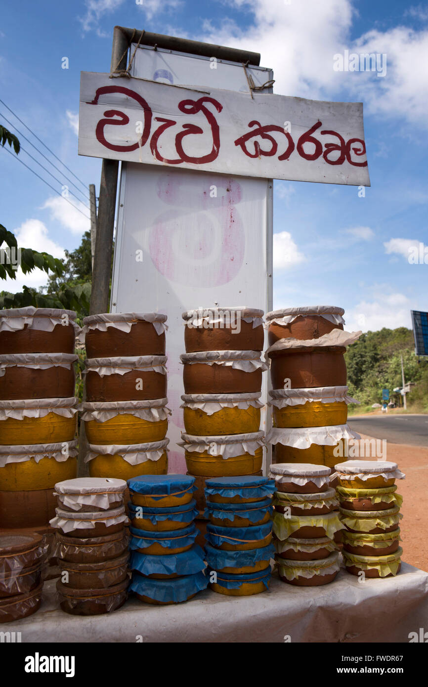 Sri Lanka, Galoya, buffalo curd in clay pots for sale in roadside stall