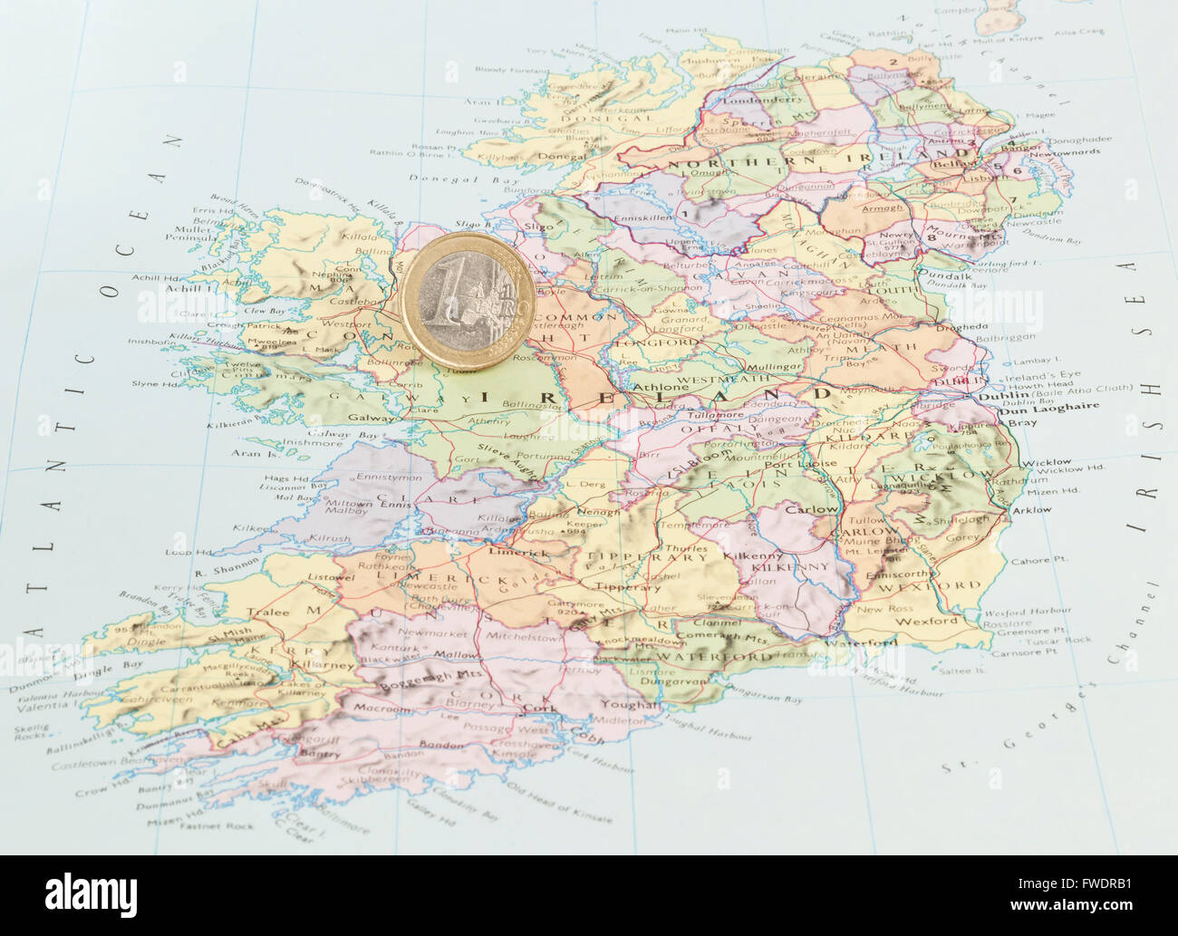 A Euro coin on a map of Ireland Stock Photo
