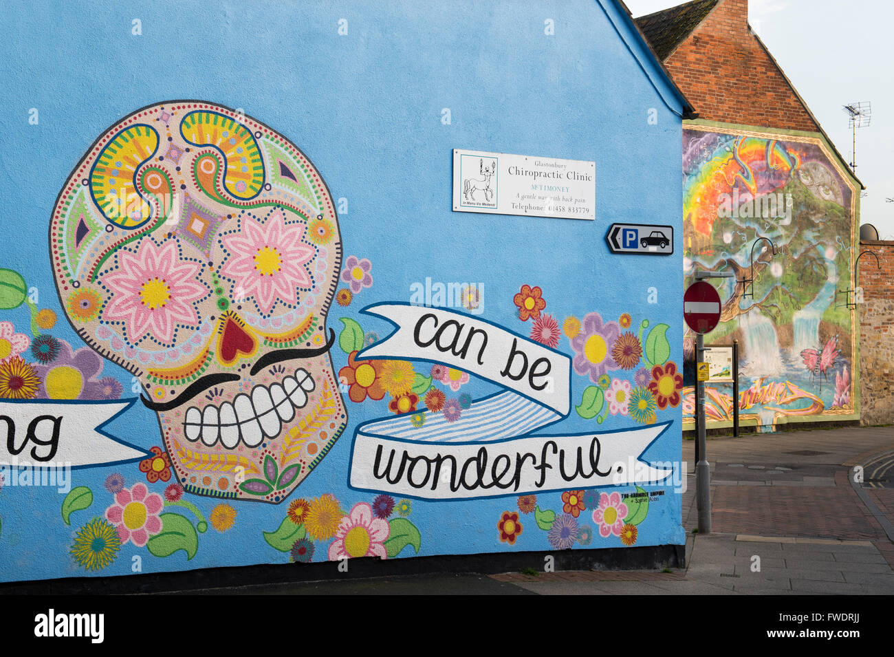 Colourful Skull wall mural. Glastonbury, Somerset, England Stock Photo