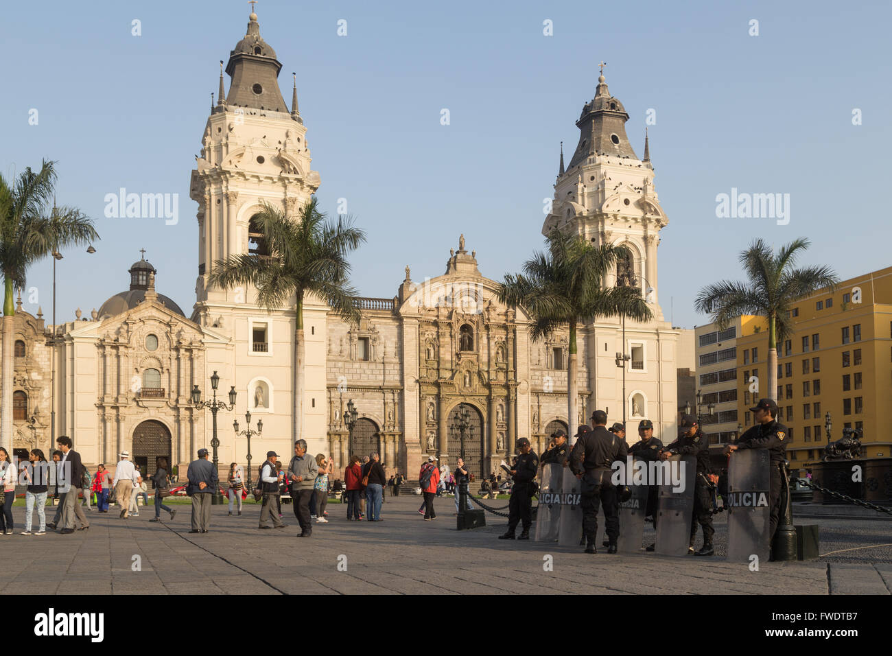 Lima, Peru - September 17, 2015: Policemen are guarding the central square in front of the cathedral. Stock Photo