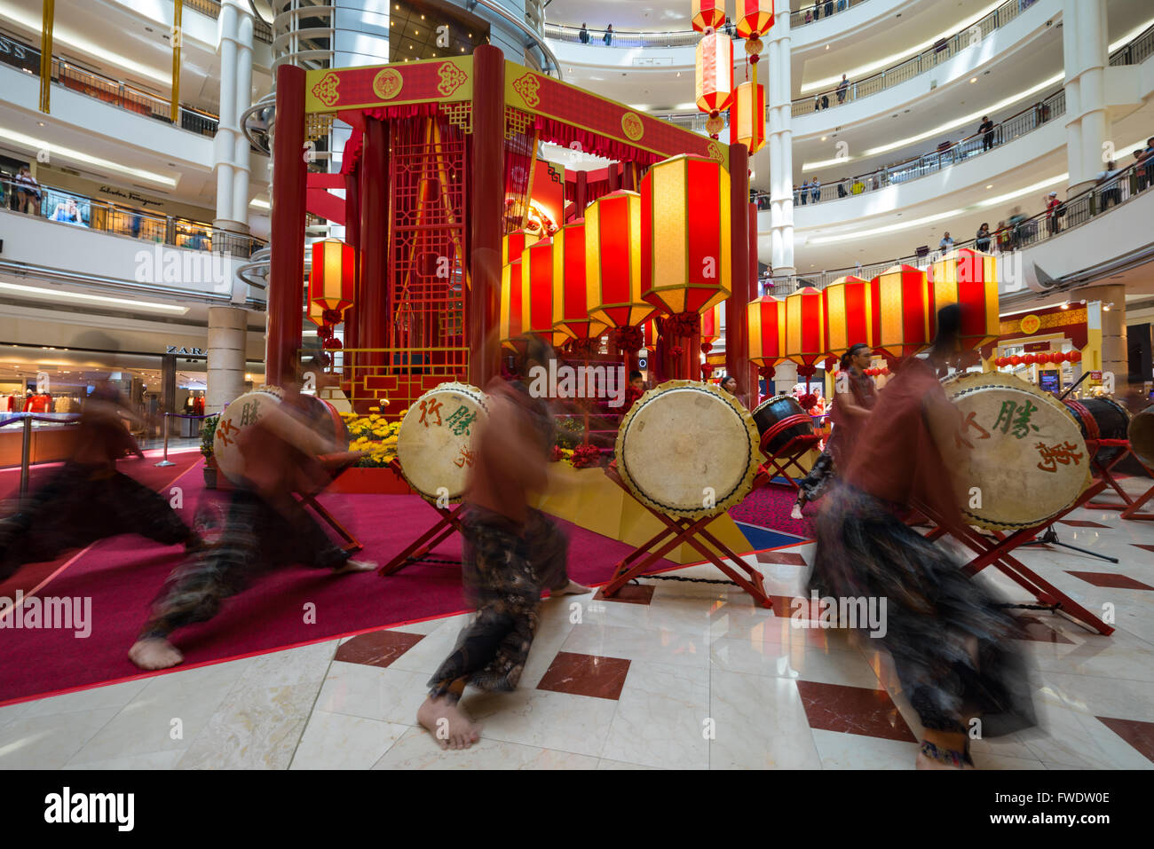Drum performer as part of lion dance in Kuala Lumpur City Centre mall