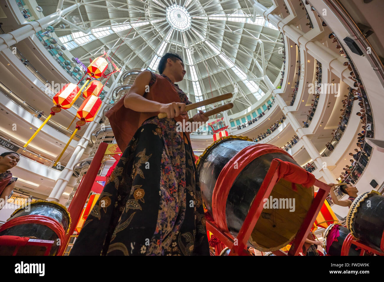 Drum performer as part of lion dance in Kuala Lumpur City Centre mall