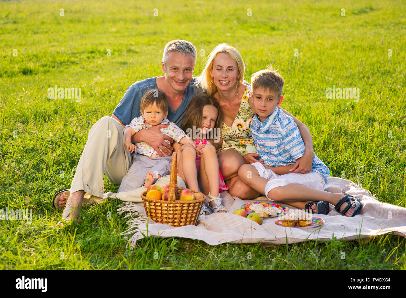 Happy family on a picnic Stock Photo - Alamy