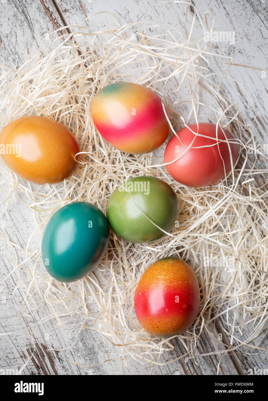 Colorful easter eggs on straw Stock Photo