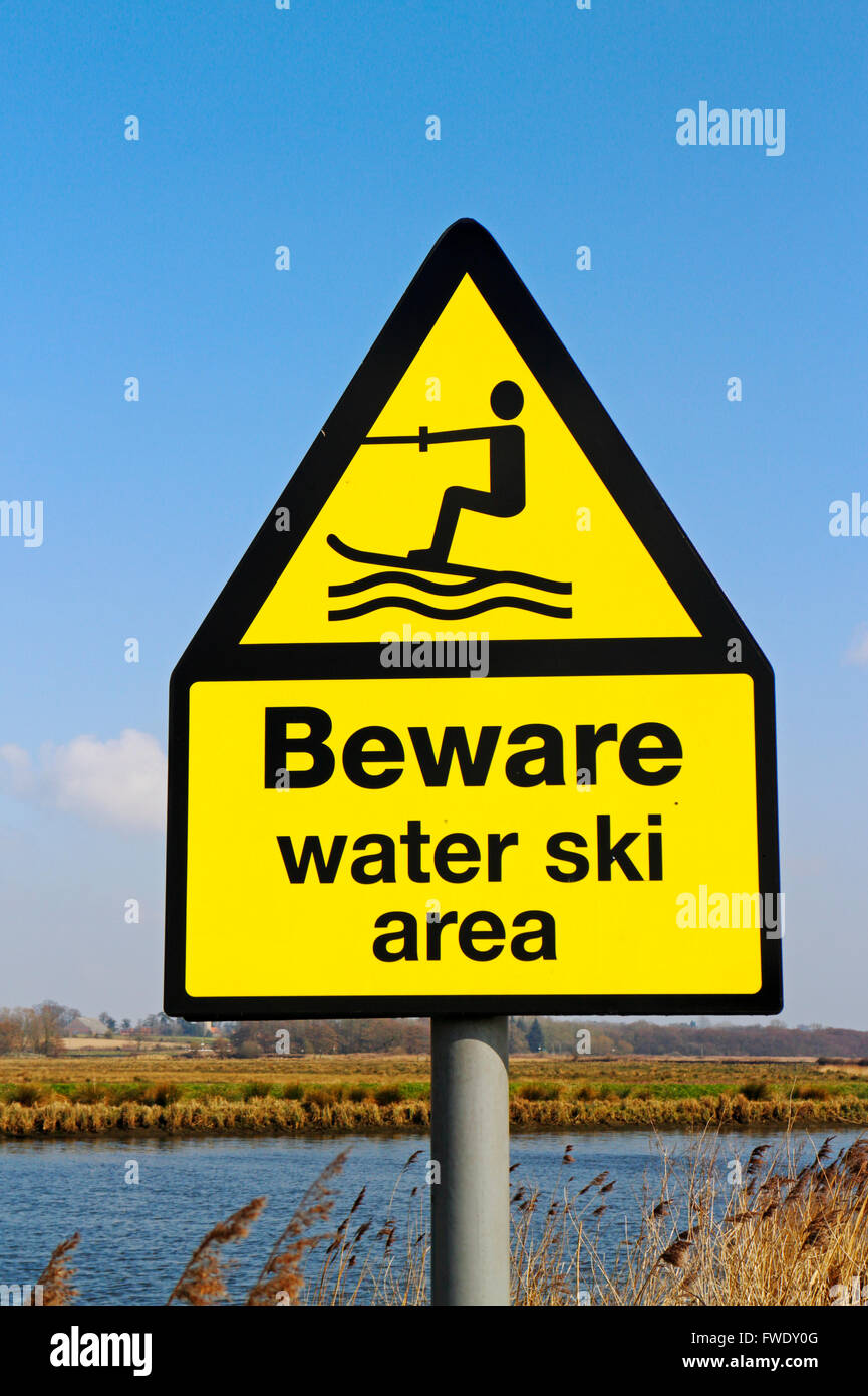 A Beware water ski area sign by the River Yare at Rockland St Mary, Norfolk, England, United Kingdom. Stock Photo