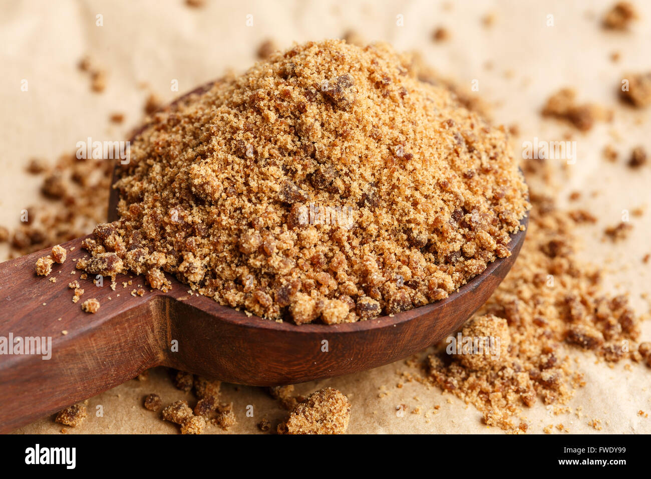 Coconut sugar on wooden spoon Stock Photo