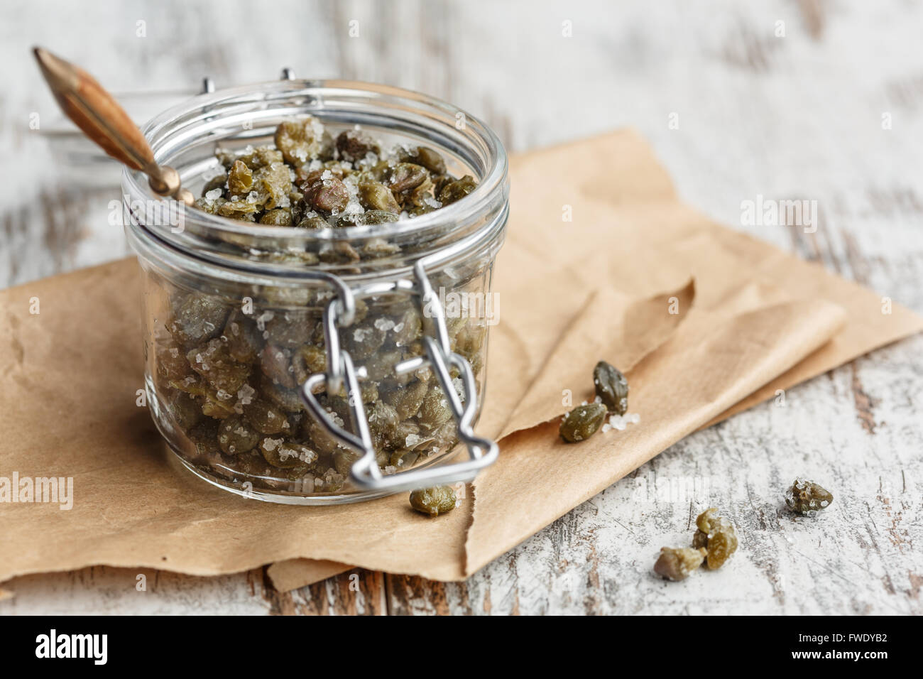 Salted capers in glass jar Stock Photo Alamy