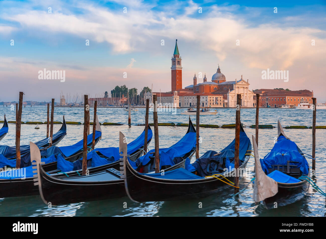 Gondolas at twilight in Venice lagoon, Italia Stock Photo - Alamy