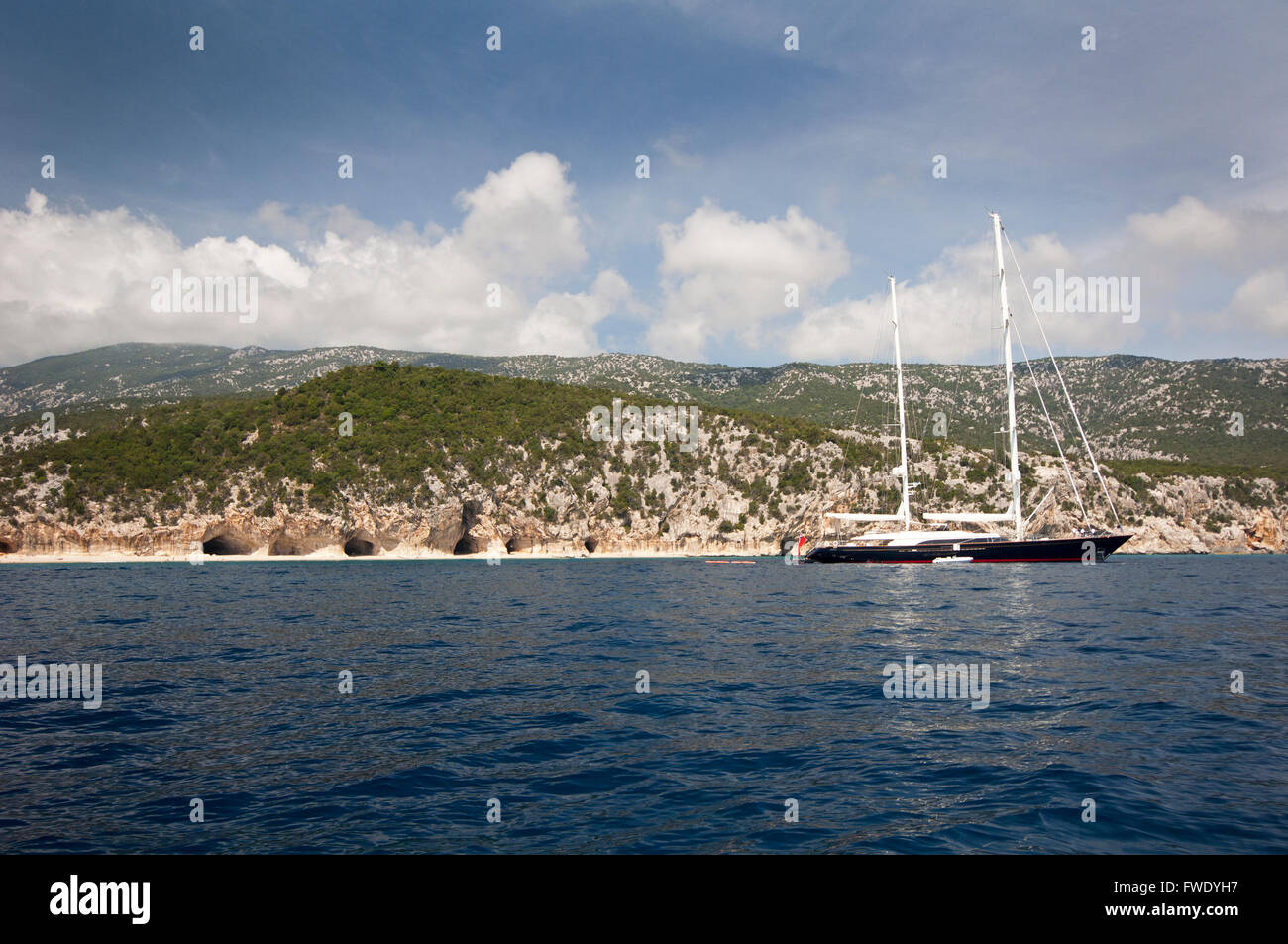 Cala Gonone, Dorgali,Sardinia,Italy, 7 /2014. Yachts along the coast near Cala Luna beach in a summer day. Stock Photo