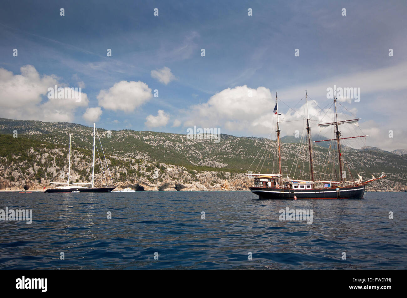 Cala Gonone, Dorgali,Sardinia,Italy, 7 /2014. Yachts along the coast near Cala Luna beach in a summer day. Stock Photo