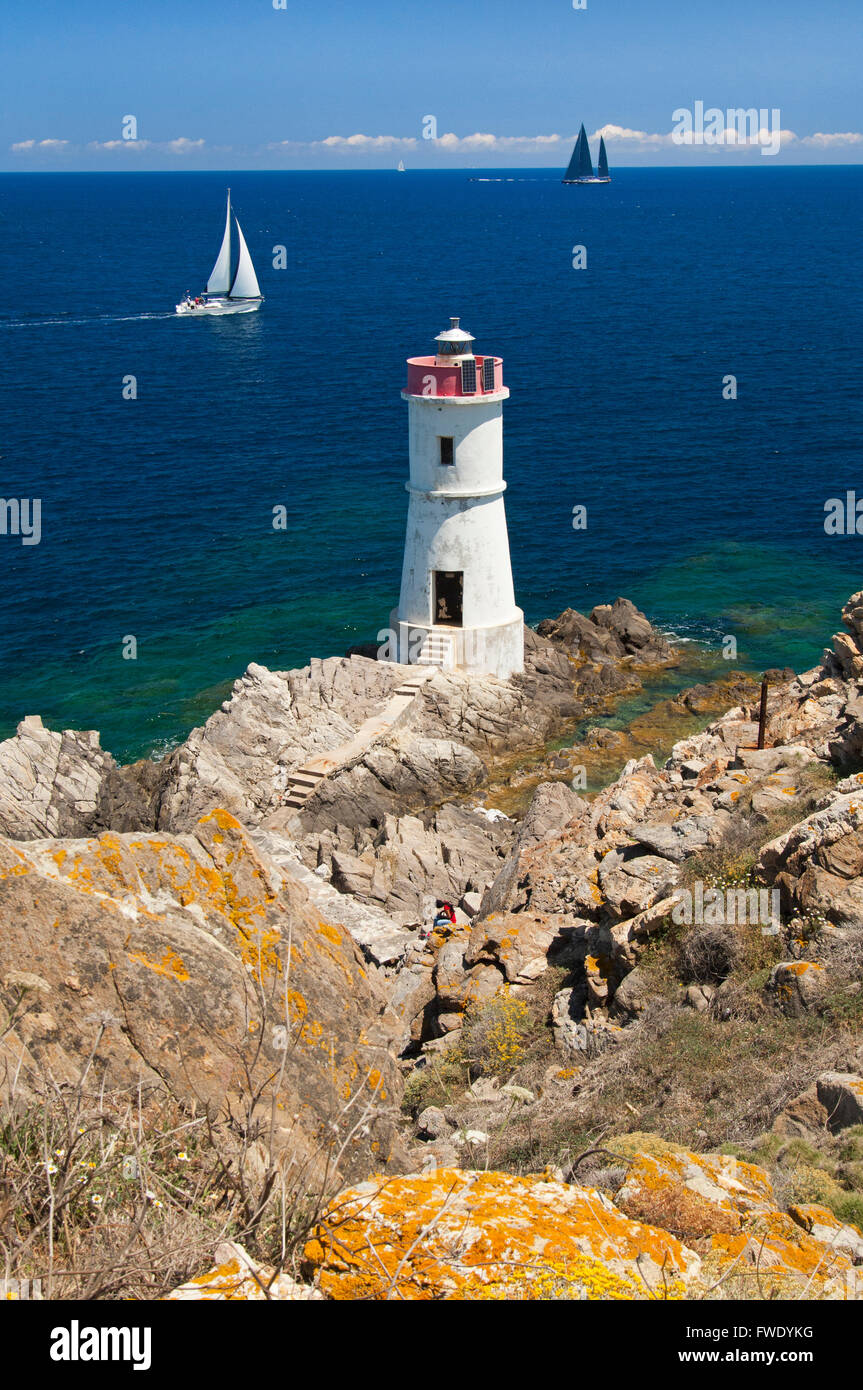 Emerald coast,Sardinia,Italy, 5/2014.Yachts sailing the coast and lighthouse near Porto Cervo, Arzachena Stock Photo