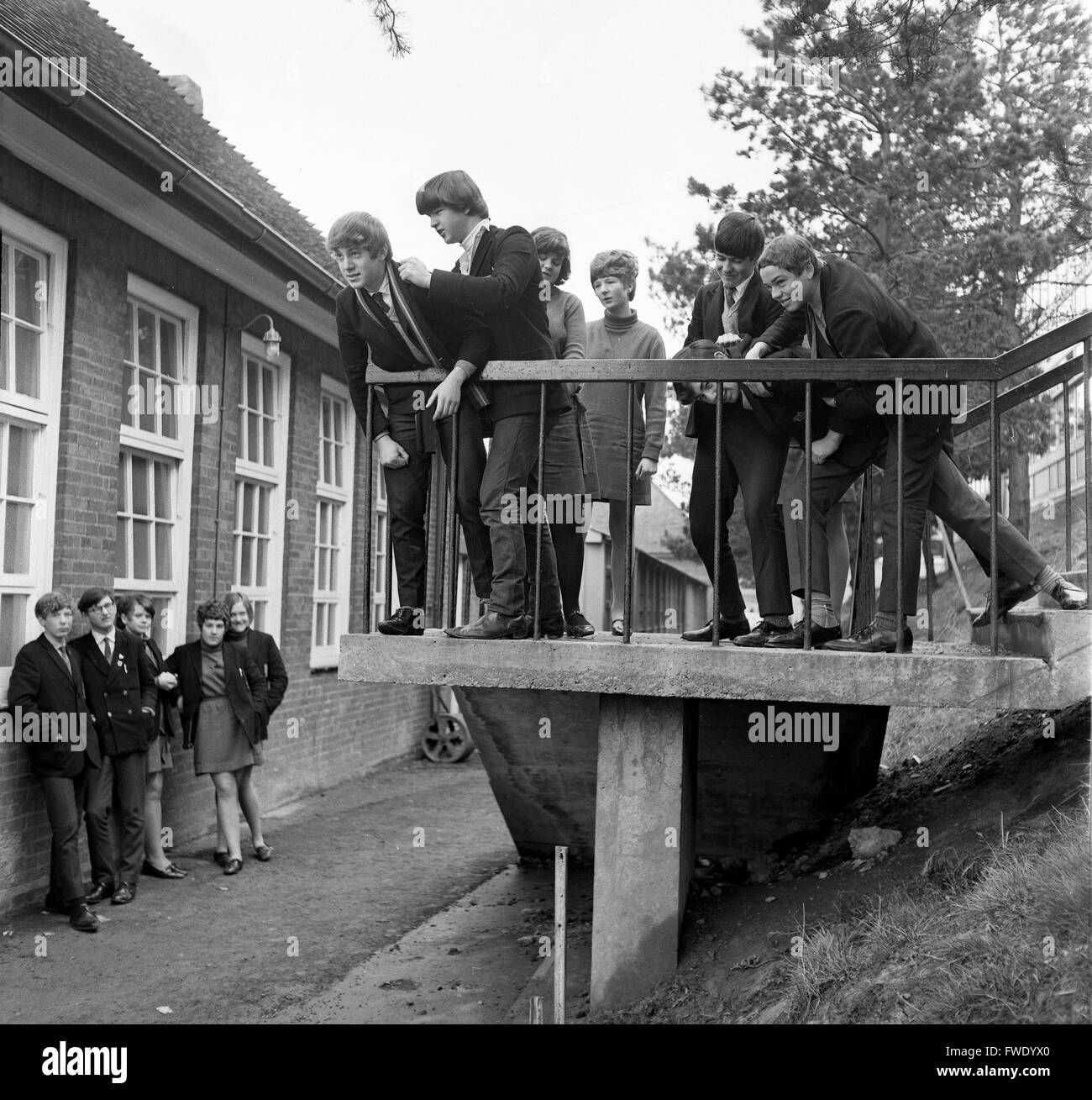 Teenage school pupils students playing in school playground as part of a drama class Britain 1960s Stock Photo