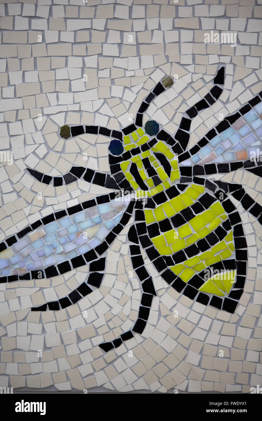 Manchester Central Library mosaic bee logo tile design emblem worker insect wings black yellow tiled artwork Stock Photo