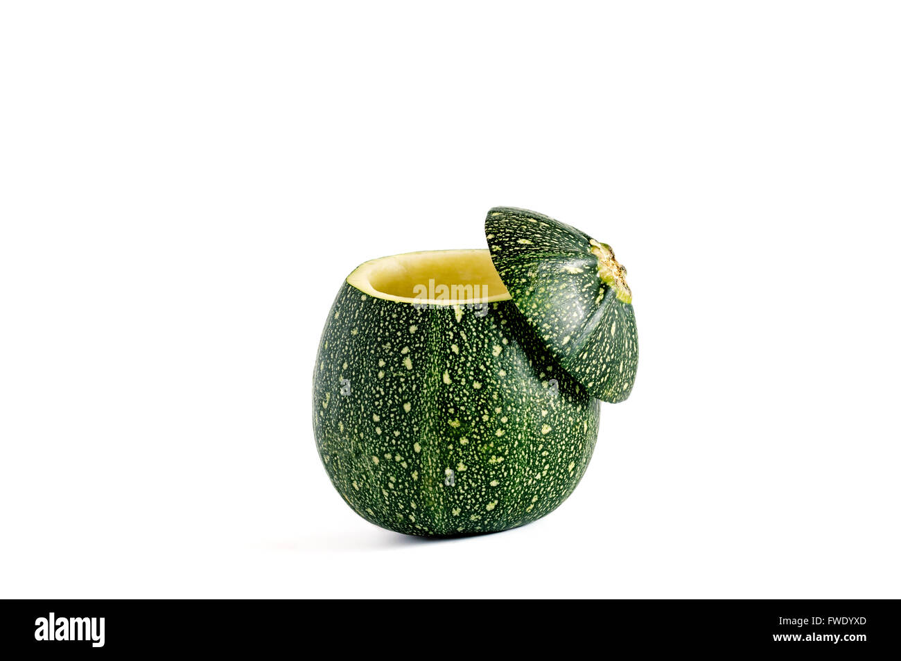 Eight ball squash with cut top and scooped out pulp isolated on white