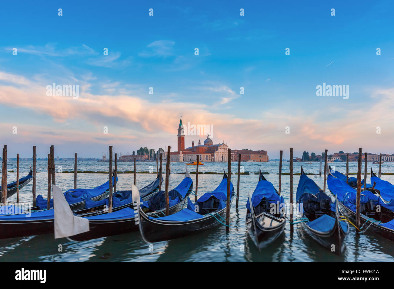 Gondolas at twilight in Venice lagoon, Italia Stock Photo - Alamy
